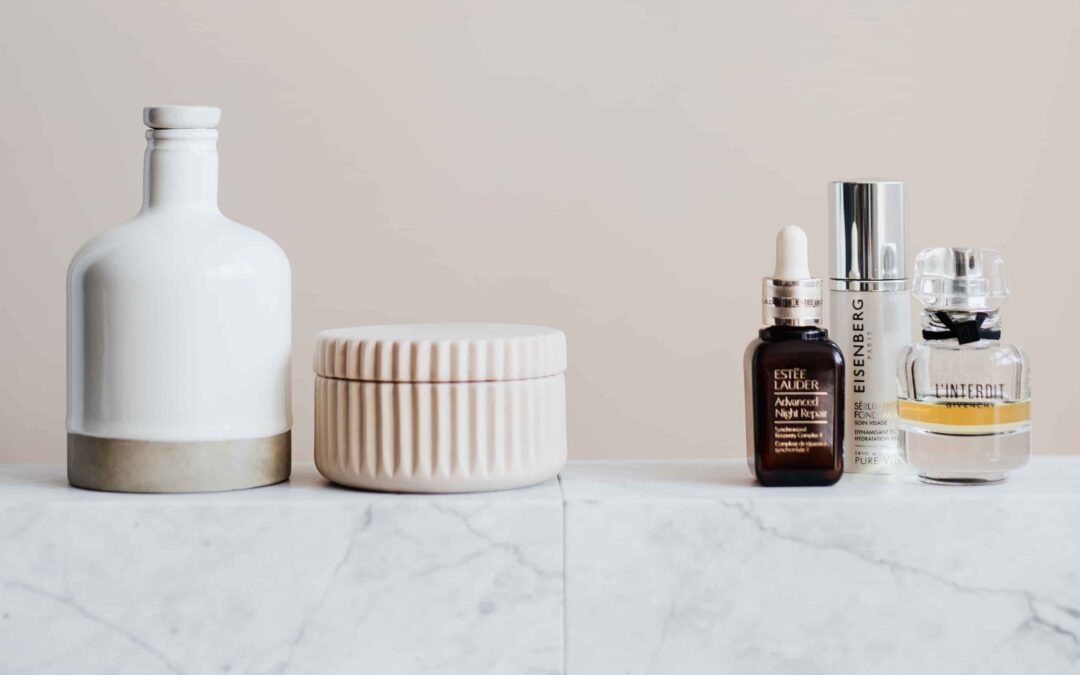 Beauty products on a marble counter.